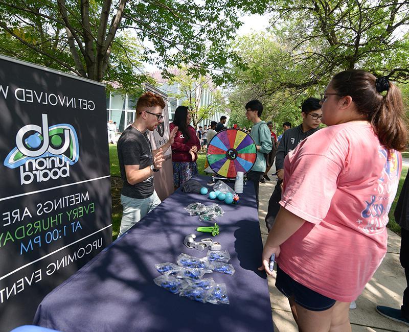 Students talking to each other at the student organization fair